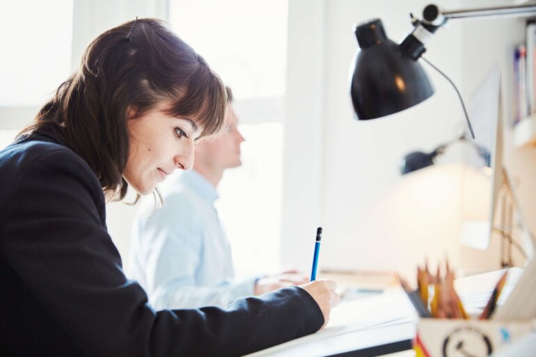 a woman working on a graphic on a drawing board 2023 11 27 05 13 37 utc